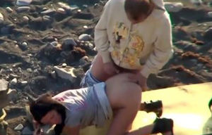 Duo on beach spycam filming